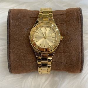 Gold Invicta watch with gold face
